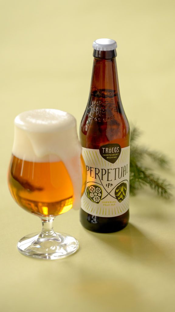 Wallpapers and lock screens - Perpetual IPA bottle and glass.