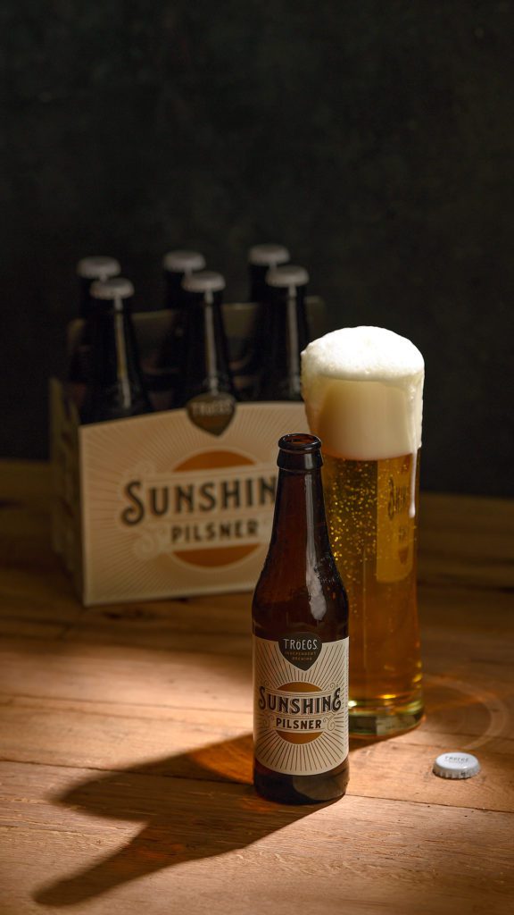 Wallpapers and lock screens - Sunshine Pils 6pack bottle and glass.