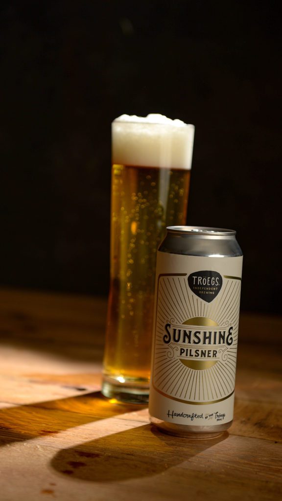 Wallpapers and lock screens - Sunshine Pils can and glass.