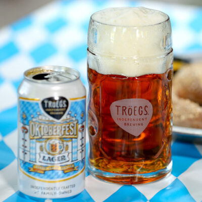 Oktoberfest cans and .5L steins with pretzel